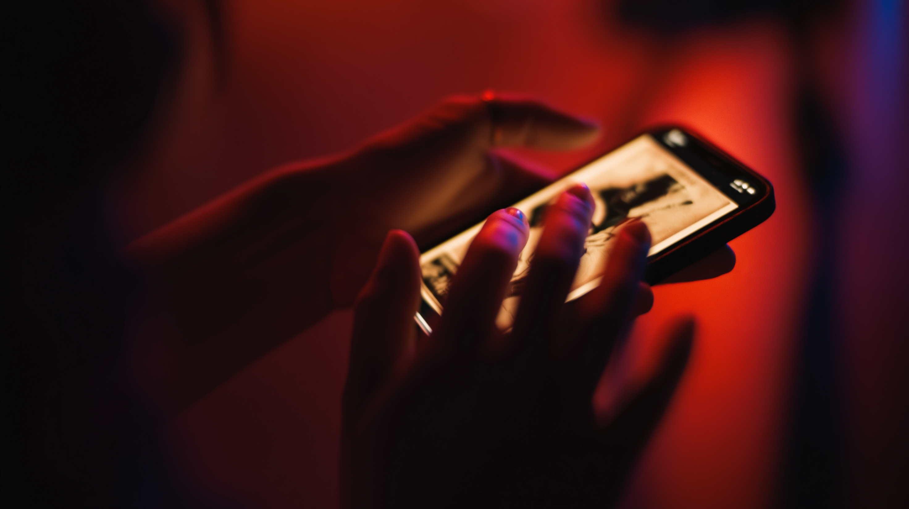 Hands holding an iPhone showing a Latin dance event card mid-swipe